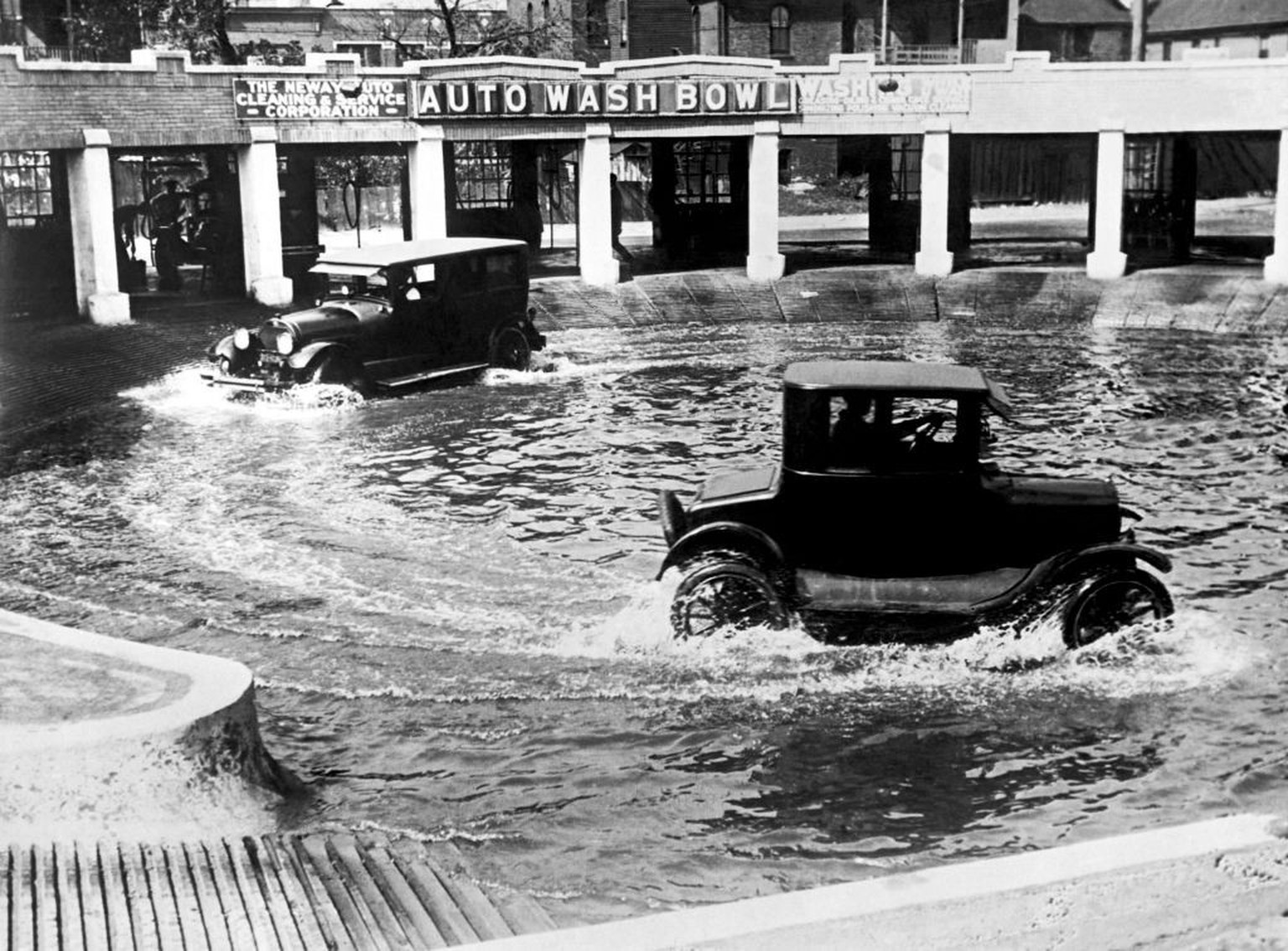 A new method of washing autos, Chicago, Illinois, September 20, 1924. Two cars at a time run through the Auto Wash Bowl to clean the mud and dirt from the wheels and axles. (Photo by Underwood Archive ...