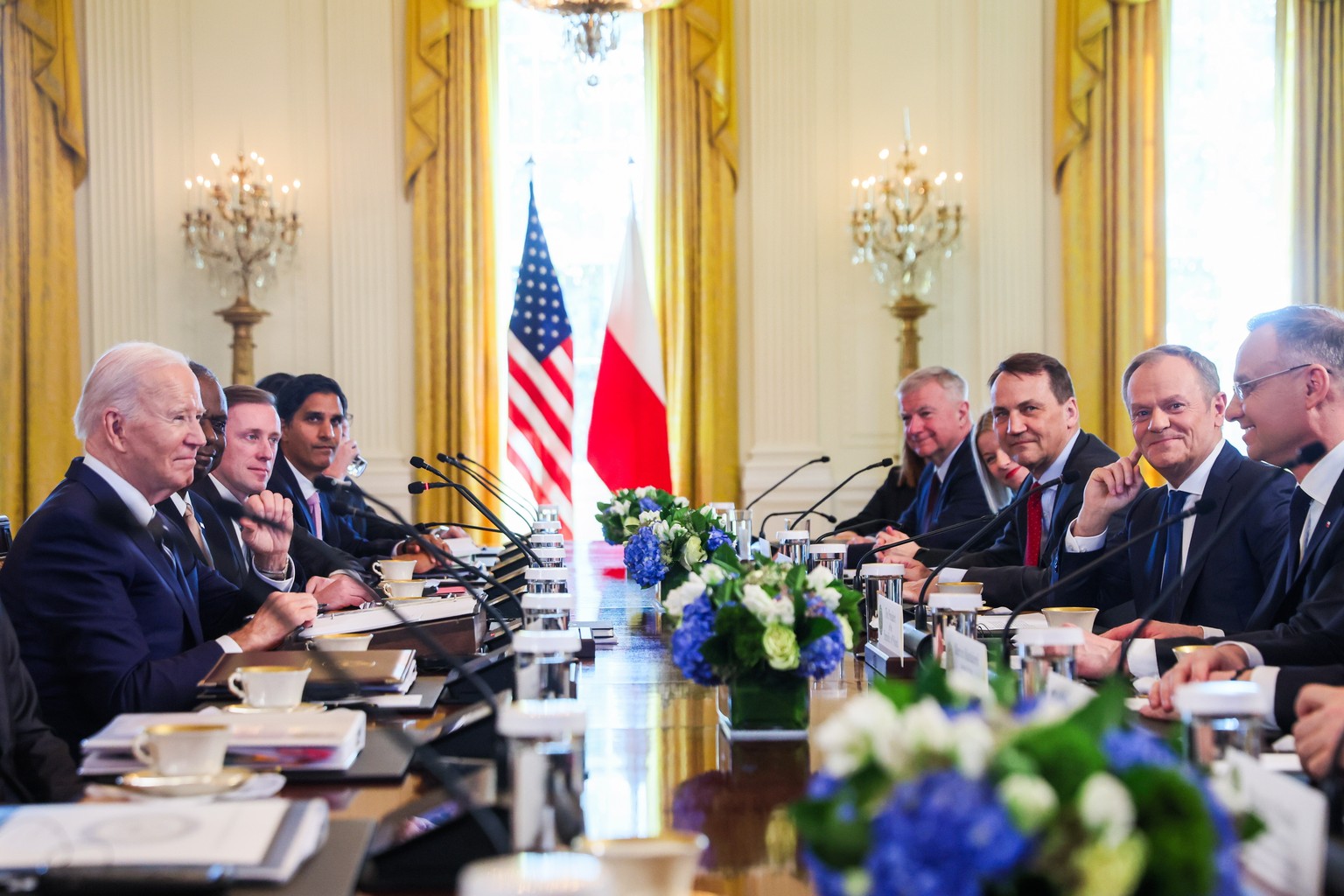 epa11217374 US President Joe Biden (L), Polish President Andrzej Duda (R) and Polish Prime Donald Tusk (2R) during their a meeting at the White House in Washington, DC, USA, 12 March 2024. Polish Pres ...
