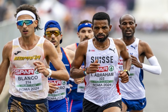 Tadesse Abraham of Switzerland, right, in action during the men&#039;s half marathon final at the European Athletics Championships, next to the Olympic stadium, in Rome, Italy, Sunday, June 9, 2024. ( ...