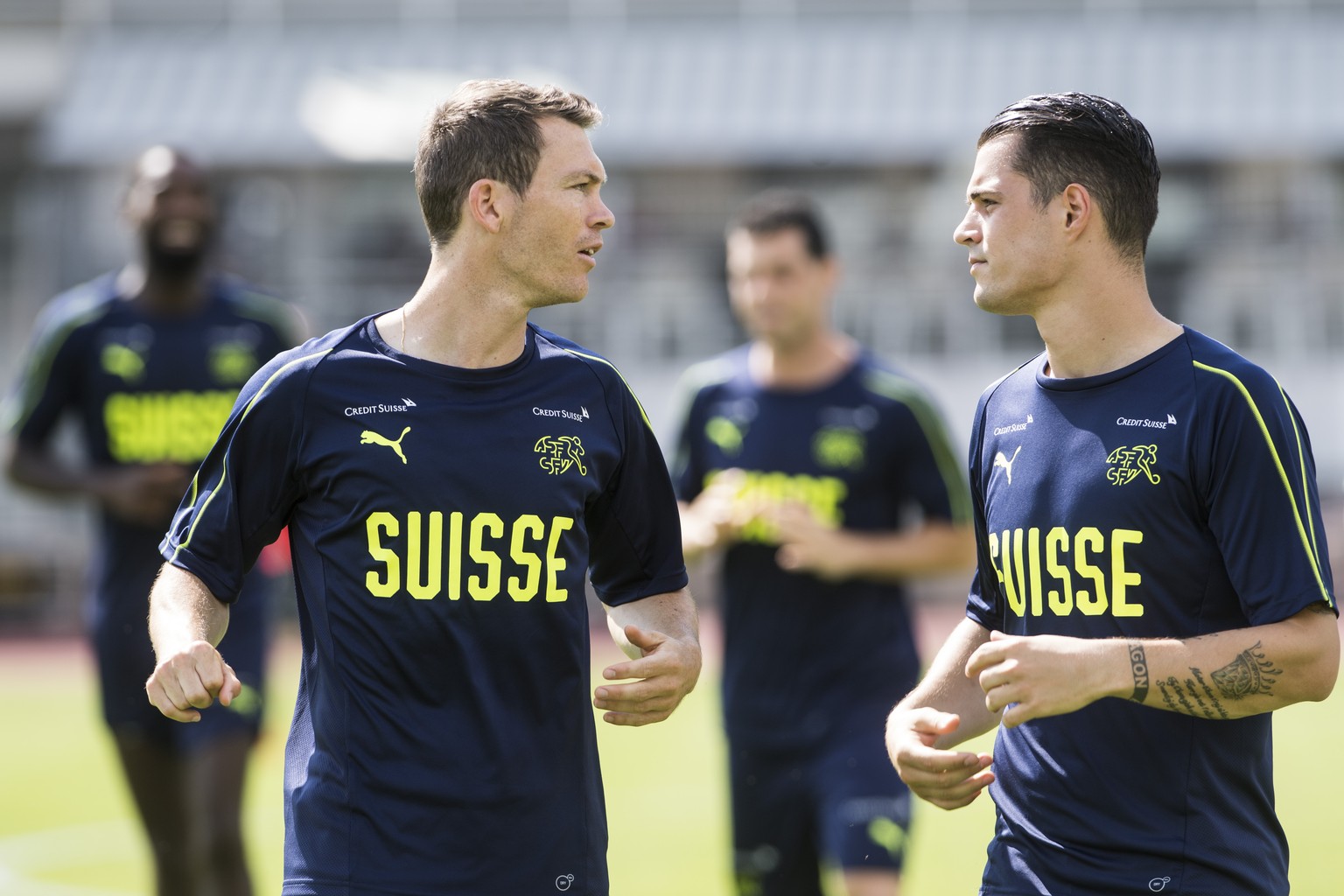 Swiss national team players Stephan Lichtsteiner, left, and Granit Xhaka, right, during a training session in Lugano, Switzerland, Thursday, June 7, 2018. (KEYSTONE/Ti-Press/Alessandro Crinari)