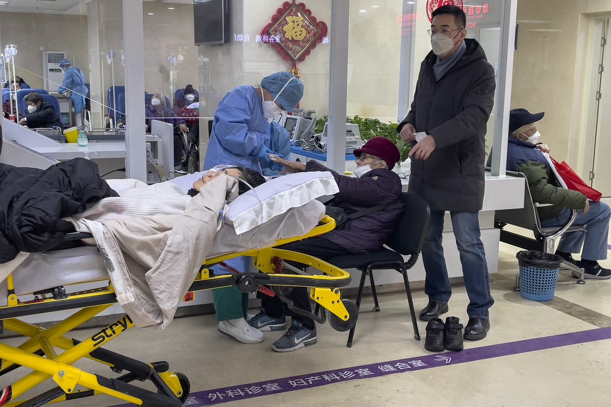 Elderly patients are checked as they arrive at an emergency hall of a hospital in Beijing, Thursday, Jan. 19, 2023. China on Thursday accused "some Western media" of bias, smears and politic ...