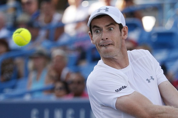 Andy Murray, of Britain, watches the ball before hitting a return to Richard Gasquet, of France, at the Western &amp; Southern Open tennis tournament, Friday, Aug. 21, 2015, in Mason, Ohio. (AP Photo/ ...