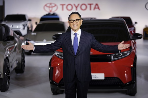 Toyota Motor Corp. President Akio Toyoda gestures for photographers during a press conference regarding battery EV strategies Tuesday, Dec. 14, 2021, in Tokyo. (AP Photo/Eugene Hoshiko)
Akio Toyoda