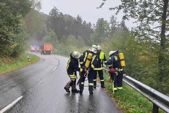 epa07905733 Firefighters prepare their gear near the crash site of an F-16 fighter plane between the city Trier and US Air Base Spangdahlem, near Zemmer, Germany, 08 October 2019. Local police state a ...