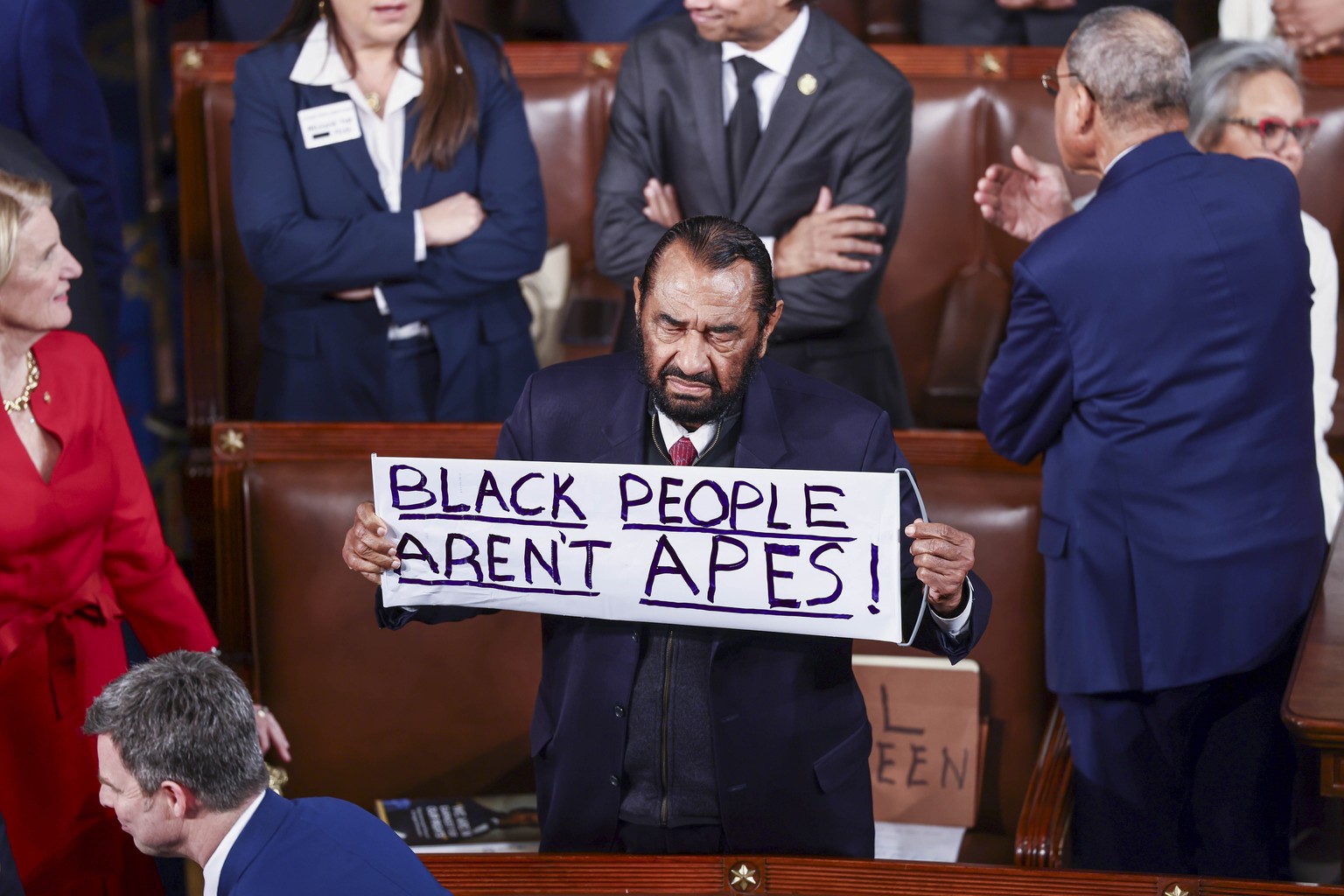 epa12775022 US Democratic Representative from Texas Al Green holds a sign that says 'Black People Arent Apes!' prior to US President Donald Trumps State of the Union address before a joint ...