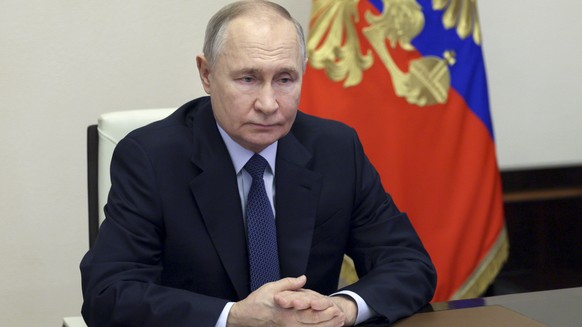 Russian President Vladimir Putin chairs a Security Council meeting via videoconference at the Novo-Ogaryovo state residence outside Moscow, Russia, Friday, Jan. 31, 2025. (Gavriil Grigorov, Sputnik, K ...