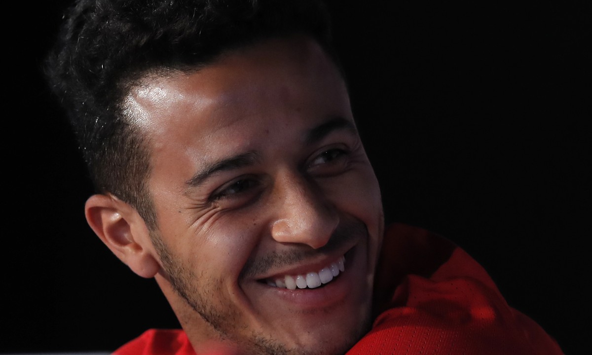 Spain's Thiago Alcantara smiles during a press conference at the Sports Complex Marcel Gaillard in Saint Martin de Re in France, Saturday, June 25, 2016. Spain will face Italy in a Euro 2016 roun ...