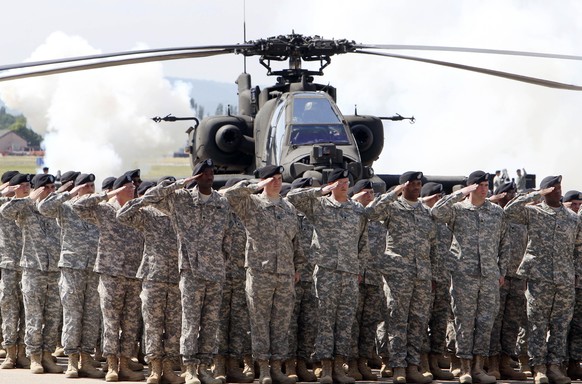 FILE - In this Friday, May 13, 2011 file photo, Soldiers of 1AD attend a color casing ceremony of the First Armored Division at the US Army Airfield in Wiesbaden, Germany. The governors of the four Ge ...