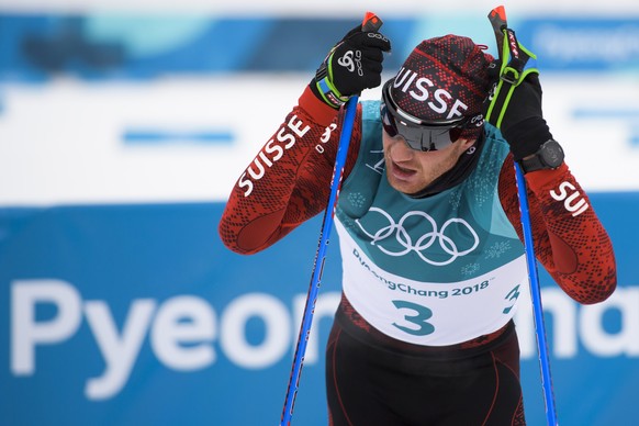 epa06514142 Dario Cologna of Switzerland reacts during the Men&#039;s Cross Country 15 km + 15 km Skiathlon race at the Alpensia Cross Country Centre during the PyeongChang 2018 Olympic Games, South K ...