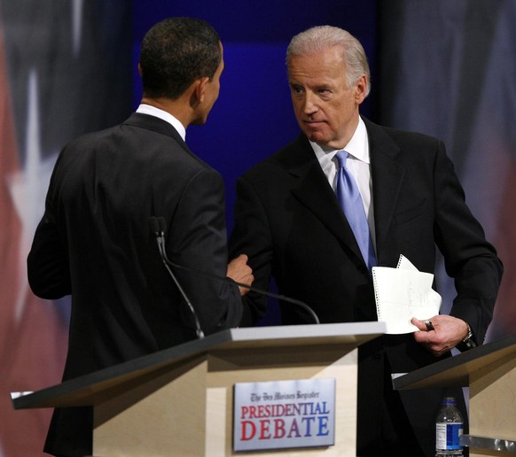 In this Dec. 13, 2007, photo, Sen. Barack Obama, D-Ill., shakes hands with Sen. Joe Biden, D-Del., during the Des Moines Register Democratic Presidential Debate in Johnston, Iowa. Obama picked Biden a ...