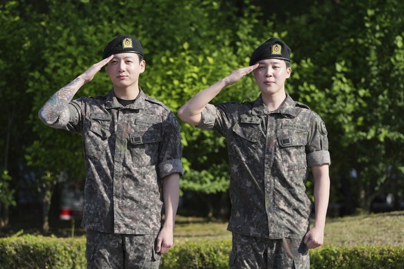 K-pop band BTS members Jimin, right, and Jung Kook salute after being discharged from a mandatory military service in Yeoncheon, South Korea, Wednesday, June 11, 2025. (AP Photo/Lee Jin-man)
Jimin,Jun ...