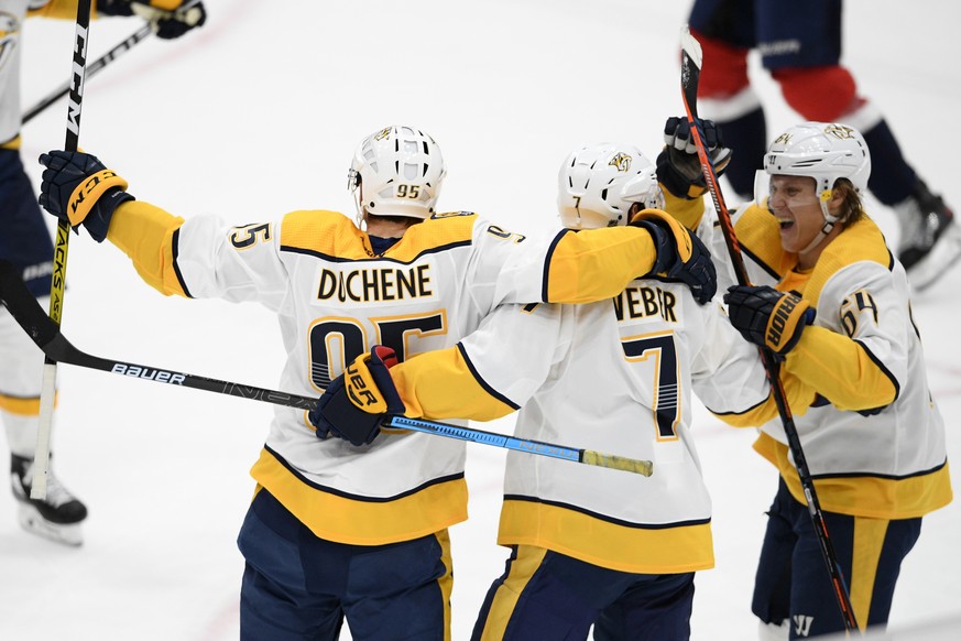 Nashville Predators defenseman Yannick Weber (7) celebrates his goal with center Matt Duchene (95) and center Mikael Granlund (64) during the third period of an NHL hockey game against the Washington  ...