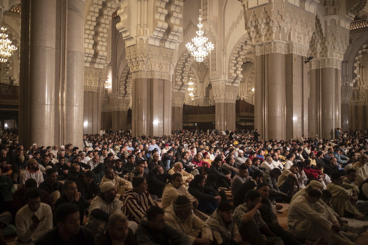 FILE - Worshippers gather to perform night prayers on the eve of Laylat-al-Qadr or Night of Power marking the 27th and holiest night of Islamic fasting month of Ramadan in Hassan II mosque in Casablan ...