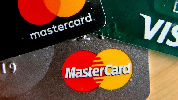 FILE - In this Feb. 20, 2019, file photo are Mastercard and Visa credit cards in Zelienople, Pa. (AP Photo/Keith Srakocic, File)
Visa Mastercard Settlement