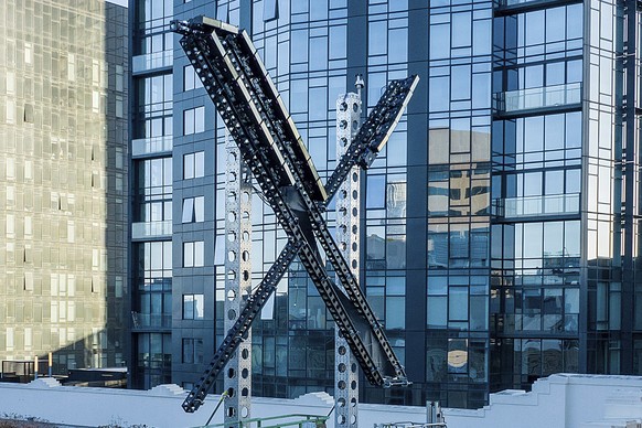 File - An &quot;X&quot; sign sits atop the social media platform&#039;s headquarters, in San Francisco, on July 28, 2023. IBM has stopped advertising on X after a report said its ads were appearing al ...