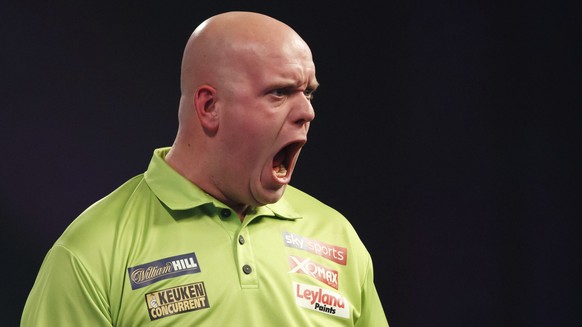 Michael van Gerwen of the Netherlands celebrates during his match against Britain&#039;s Gerwyn Price on day eleven of the World Darts Championship at Alexandra Palace, London, Wednesday, Dec. 27, 201 ...
