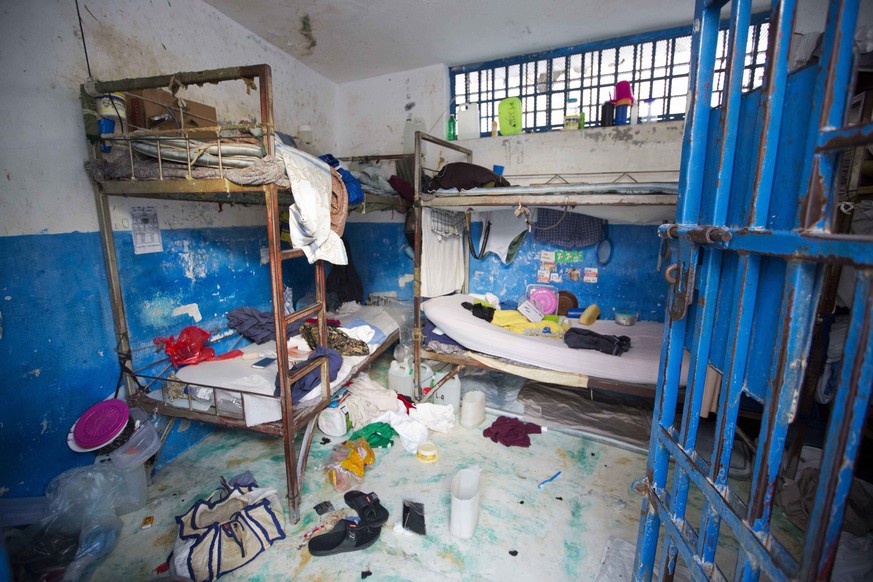 A prison cell is empty after inmates escaped from the Civil Prison in the coastal town of Arcahaiea, Haiti, Saturday, Oct. 22, 2016. Over 100 inmates escaped after they overpowered guards who were esc ...