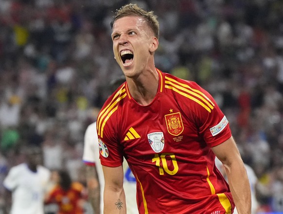 Spain&#039;s Dani Olmo celebrates after scoring his side&#039;s second goal during a semifinal match between Spain and France at the Euro 2024 soccer tournament in Munich, Germany, Tuesday, July 9, 20 ...