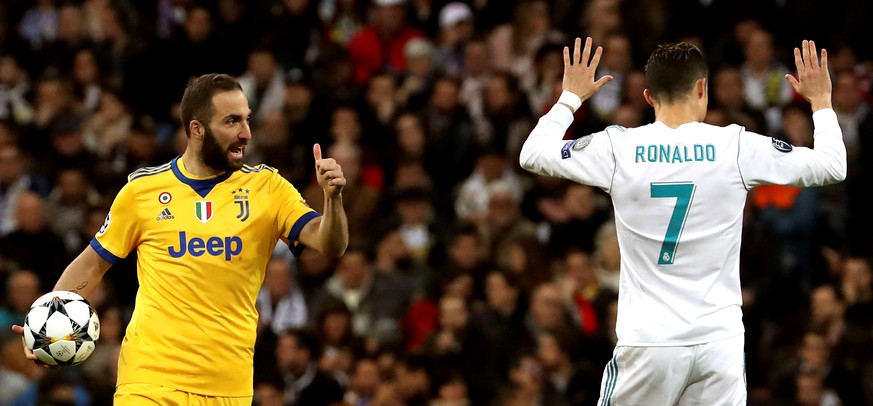 epa06864135 (FILE) Juventus&#039; Gonzalo Higuain (L) and Real Madrid&#039;s Cristiano Ronaldo (R) react during the UEFA Champions League quarter final, second leg soccer match between Real Madrid and ...