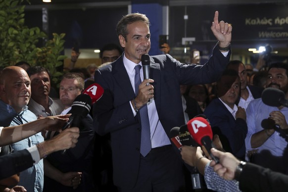 Greek opposition New Democracy conservative party leader Kyriakos Mitsotakis talks to his supporters at the New Democracy headquarters in Athens, on Sunday, July 7, 2019. Official results from nearly  ...