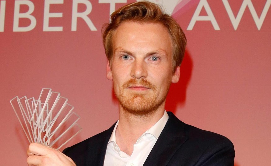 epa07241842 German journalist Claas Relotius holds his award trophy of the Reemtsma Liberty Award, a German journalist award, in Berlin, Germany, 22 March 2017 (issued 20 December 2018). German weekly ...