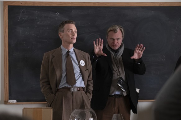 This image released by Universal Pictures shows writer-director-producer Christopher Nolan, right, and actor Cillian Murphy on the set of &quot;Oppenheimer.&quot; (Melinda Sue Gordon/Universal Picture ...