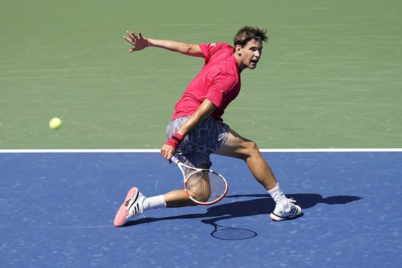 Dominic Thiem, of Austria, returns a shot to Jaume Munar, of Spain, during the first round of the US Open tennis championships, Tuesday, Sept. 1, 2020, in New York. (AP Photo/Seth Wenig)