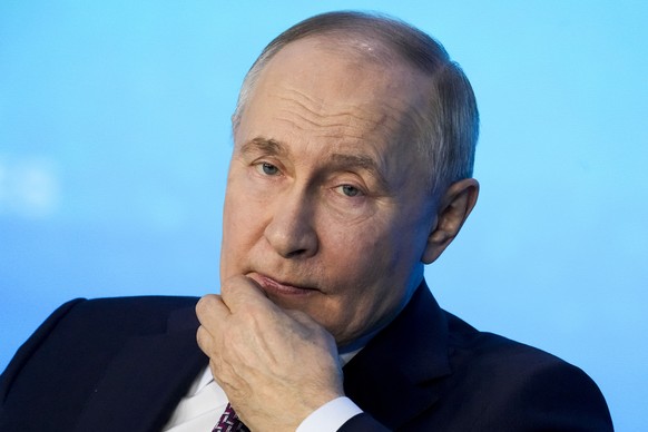 Russian President Vladimir Putin listens to a question during a Technology Forum in Moscow, Russia, Friday, Feb. 21, 2025. (AP Photo/Pavel Bednyakov)