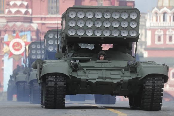 epa09182499 Russian TOS-1A multiple rocket launchers move during the Victory Day military parade general rehearsal in Moscow, Russia, 07 May 2021. The Victory Day military parade will take place 09 Ma ...