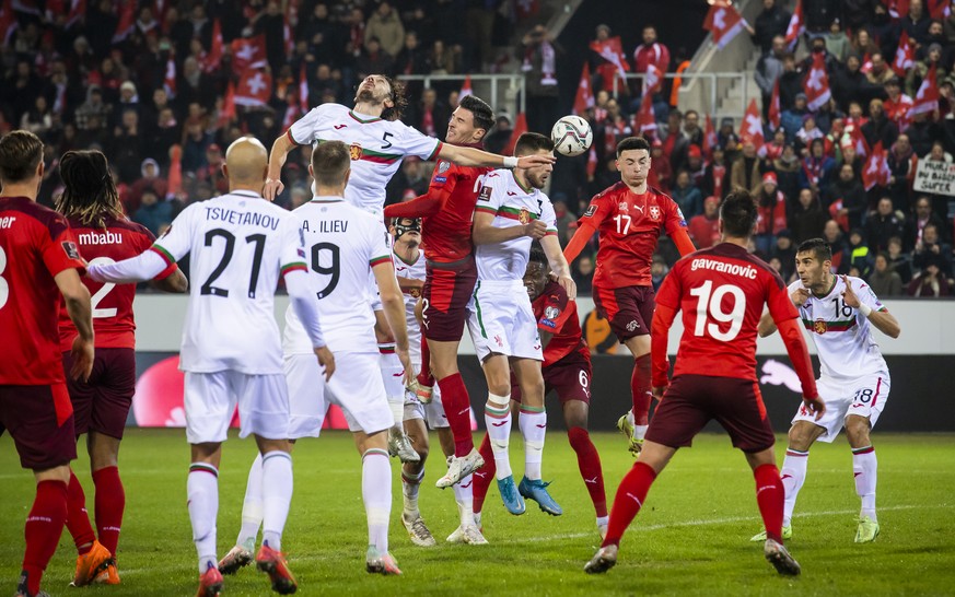 Bulgaria&#039;s defender Kristian Dimitrov, center left, fights for the ball against Switzerland&#039;s defender Fabian Schaer, center right, during the 2022 FIFA World Cup European Qualifying Group C ...