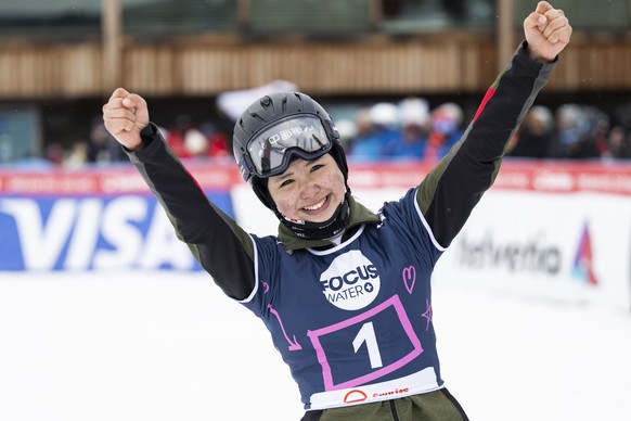 epa11981350 Winner Tsubaki Miki of Japan celebrates in the finish area for the Snowboard Alpine Parallel Slalom competition at the FIS Snowboard & Freestyle World Championships in St. Moritz, Swit ...