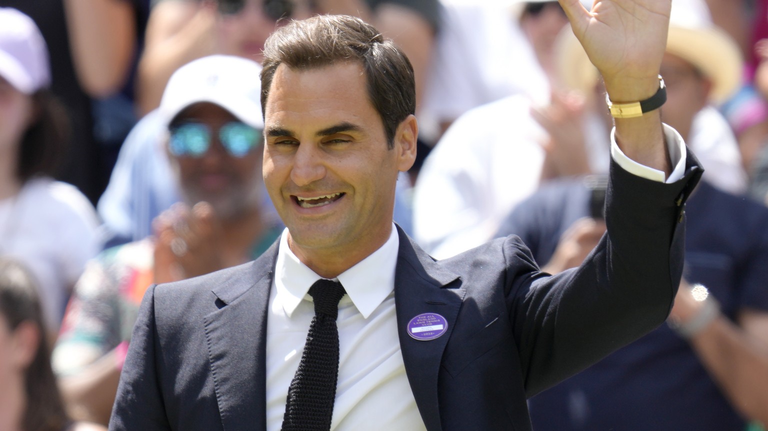 Switzerland&#039;s Roger Federer waves during a 100 years of Centre Court celebration on day seven of the Wimbledon tennis championships in London, Sunday, July 3, 2022. (AP Photo/Kirsty Wigglesworth)