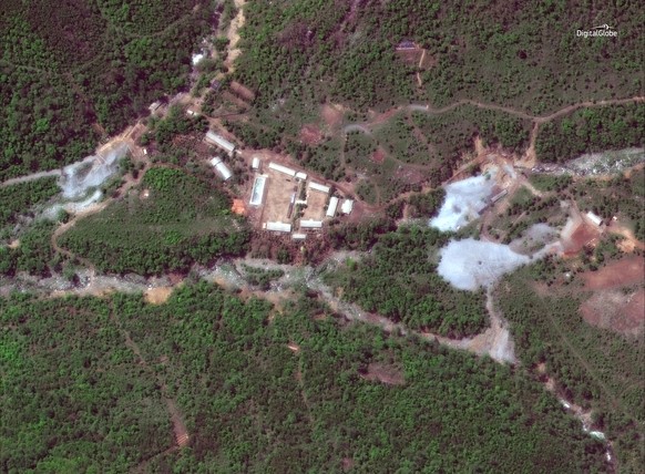 This May 23, 2018 satellite image provided by DigitalGlobe shows the nuclear test site in Punggye-ri, North Korea. A group of foreign journalists departed by train Wednesday to watch the dismantling o ...