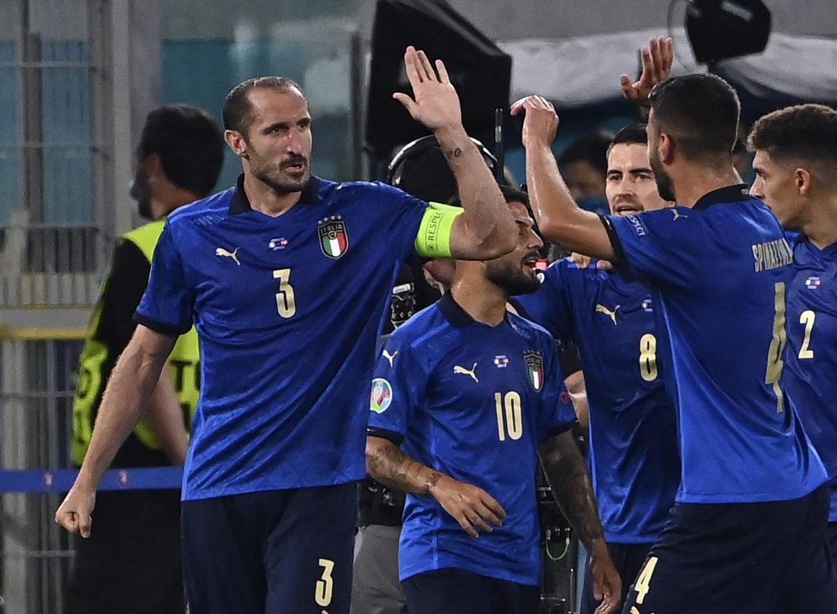 Italy's Giorgio Chiellini, left, celebrates after scoring a goal, which was later disallowed, during the Euro 2020 soccer championship group A match between Italy and Switzerland at Olympic stadi ...