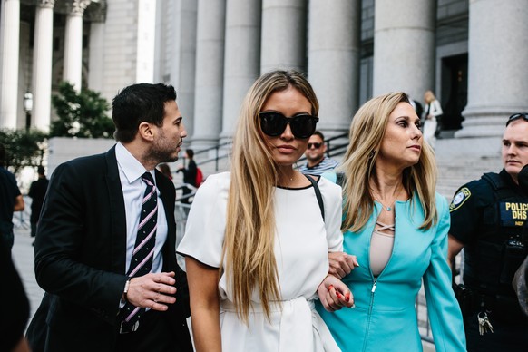 epa07798161 Jennifer Araoz (C), one of deceased financier Jeffrey Epstein's alleged victims, and her attorney Kimberly Lerner (R), exit the United States Federal Courthouse in New York, New York, ...