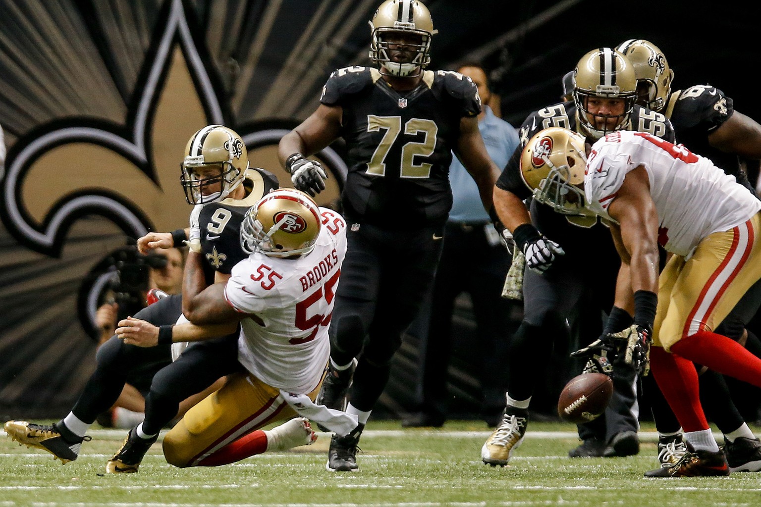 Nov 9, 2014; New Orleans, LA, USA; San Francisco 49ers outside linebacker Ahmad Brooks (55) sacks New Orleans Saints quarterback Drew Brees (9) in overtime at Mercedes-Benz Superdome. The 49ers won 27 ...