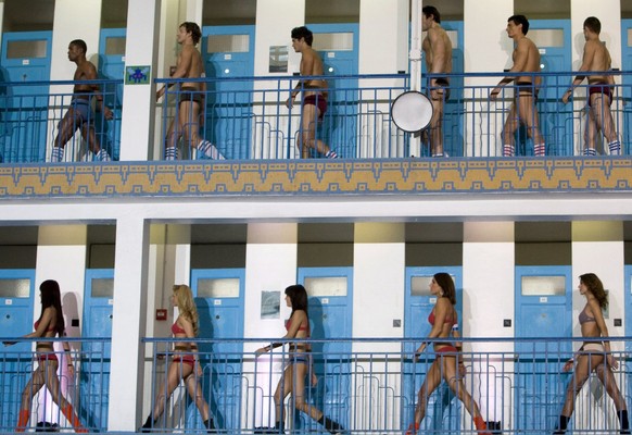 epa01548788 Contestants exit the changing rooms during the grand final of the worldwide &#039;Show Me Your Sloggi&#039; contest for the World&#039;s most beautiful bottom, held in Paris, France, 12 No ...