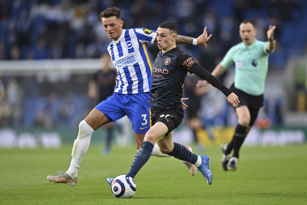 Manchester City's Phil Foden controls the ball before scoring his side's second goal during the English Premier League soccer match between Brighton &amp; Hove Albion and Manchester City at  ...