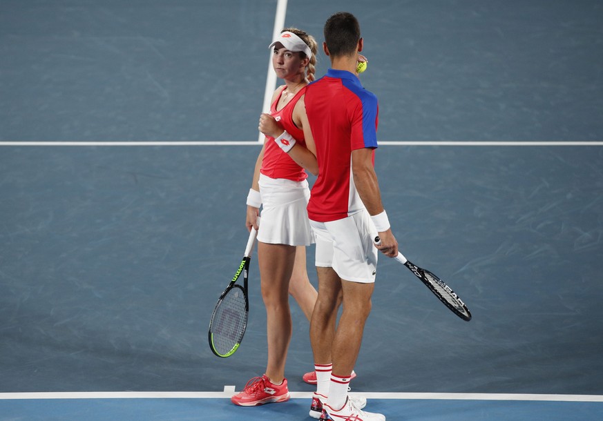 epa09373781 Novak Djokovic (R) and Nina Stojanovic (L) of Serbia speak during their Mixed Doubles First Round Tennis match against Stefani Luisa and Marcelo Melo of Brazil at the Tokyo 2020 Olympic Ga ...