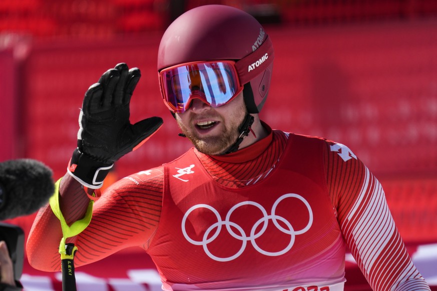 Niels Hintermann, of Switzerland, finishes during the men&#039;s downhill at the 2022 Winter Olympics, Monday, Feb. 7, 2022, in the Yanqing district of Beijing. (AP Photo/Luca Bruno)