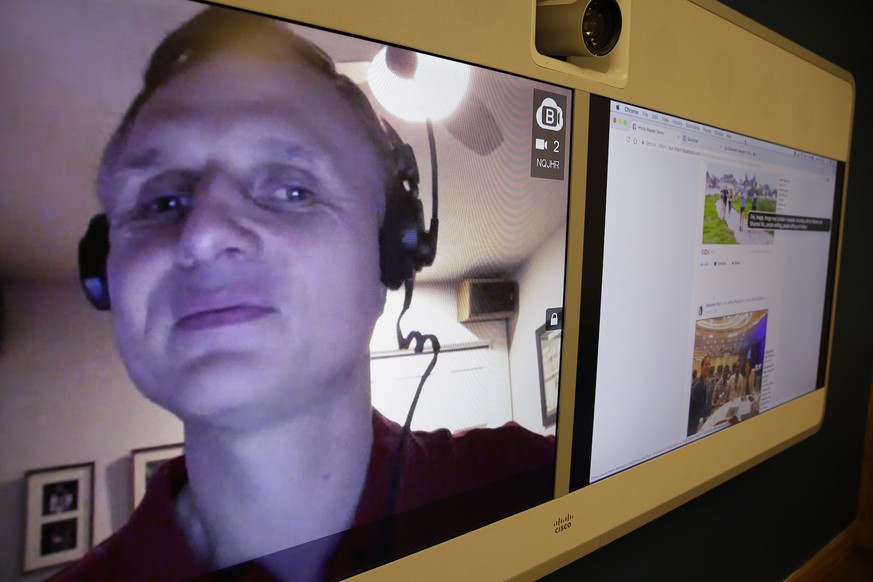 In this photo taken Monday, Dec. 18, 2017, engineer Matt King, who is blind, demonstrates facial recognition technology via a teleconference at Facebook headquarters in Menlo Park, Calif. Facebook is  ...