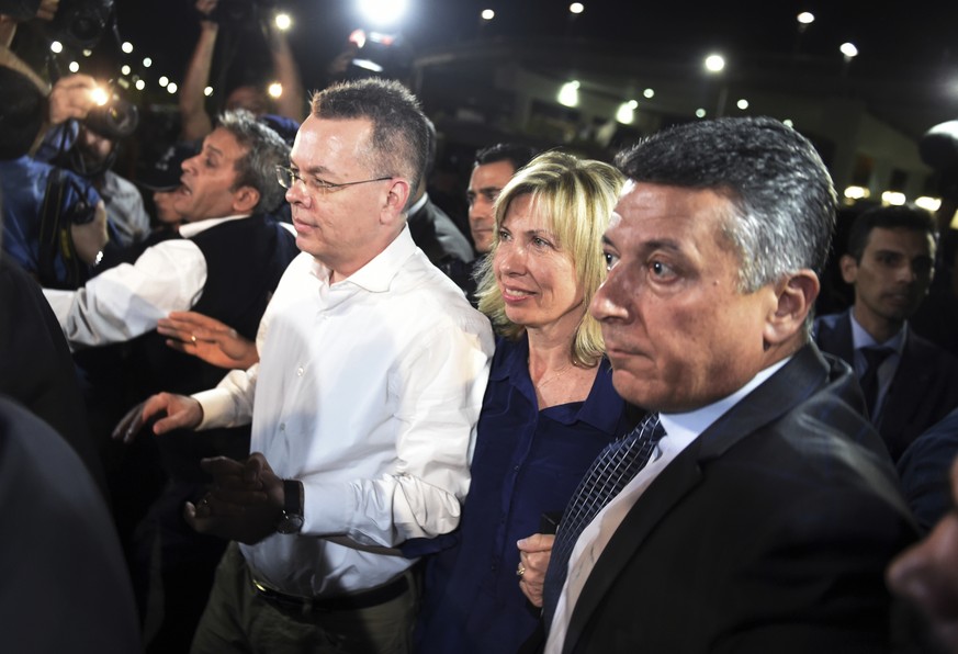 Pastor Andrew Brunson, center left, and his wife Norine Brunson arrive at Adnan Menderes airport for a flight to Germany after his release following his trial in Izmir, Turkey, Friday, Oct. 12, 2018,  ...