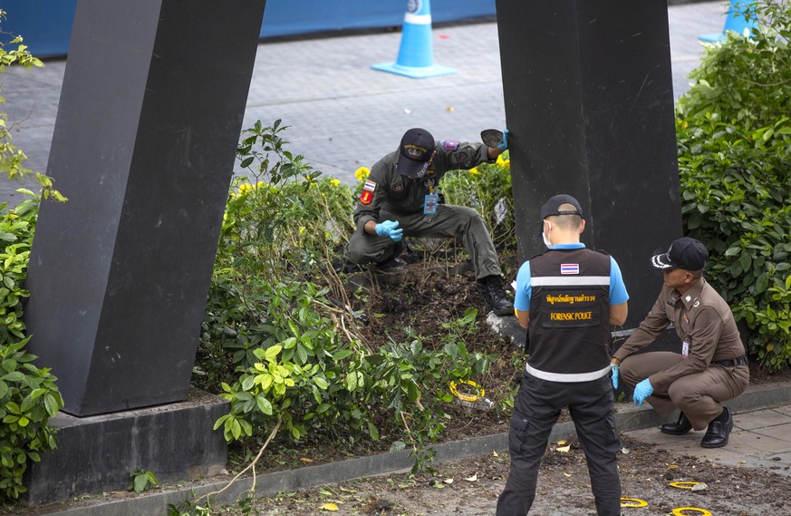 Thai investigators examine a site of an explosion that injured people in Bangkok, Thailand, Friday, Aug. 2, 2019. Thai Prime Minister Prayuth Chan-o-cha on Friday ordered an investigation into several ...