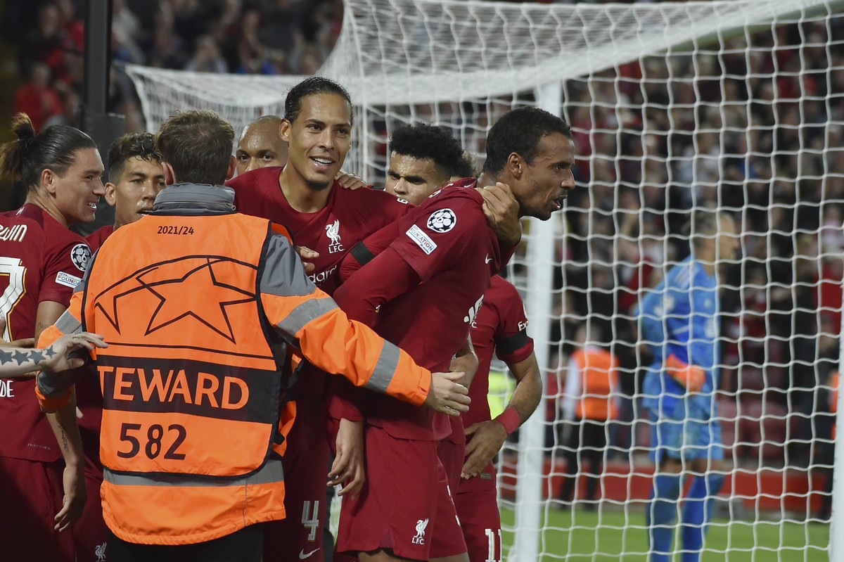 Liverpool's Joel Matip, right, celebrates with his teammates after scoring his side's second goal during the Champions League group A soccer match between Liverpool and Ajax at Anfield stadi ...