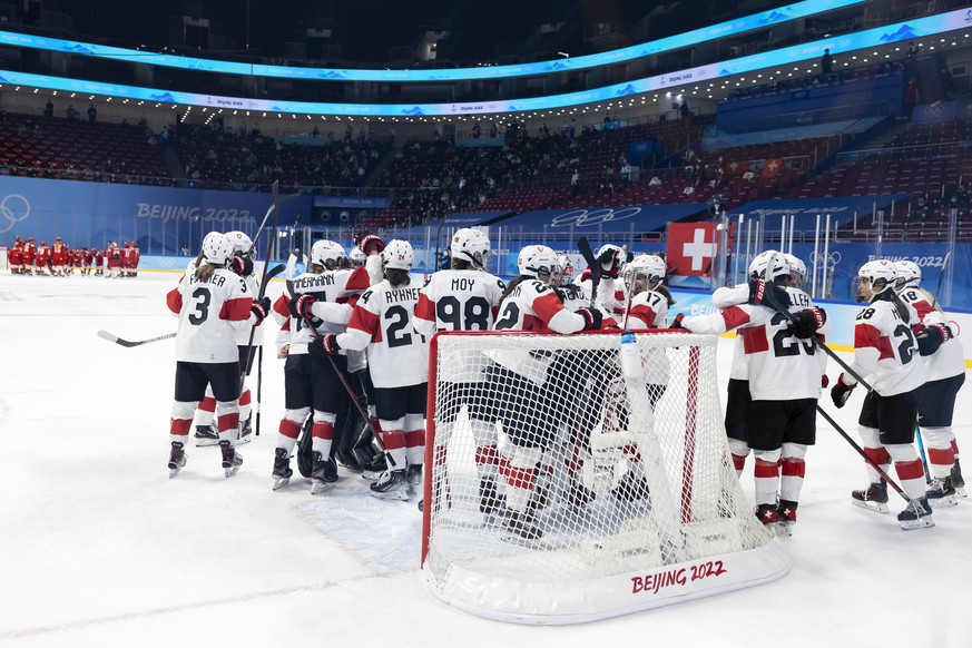 Switzerland&#039;s players celebrate after defeating Russia team, during the women&#039;s ice hockey quarterfinal game between Team ROC (Russia) and Switzerland at the Wukesong Sports Centre at the 20 ...