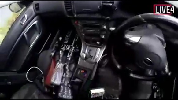 This image taken from the alleged shooter’s video, which was filmed Friday, March 15, 2019, guns on the passenger side of his vehicle in New Zealand. A witness says many people have been killed in a m ...