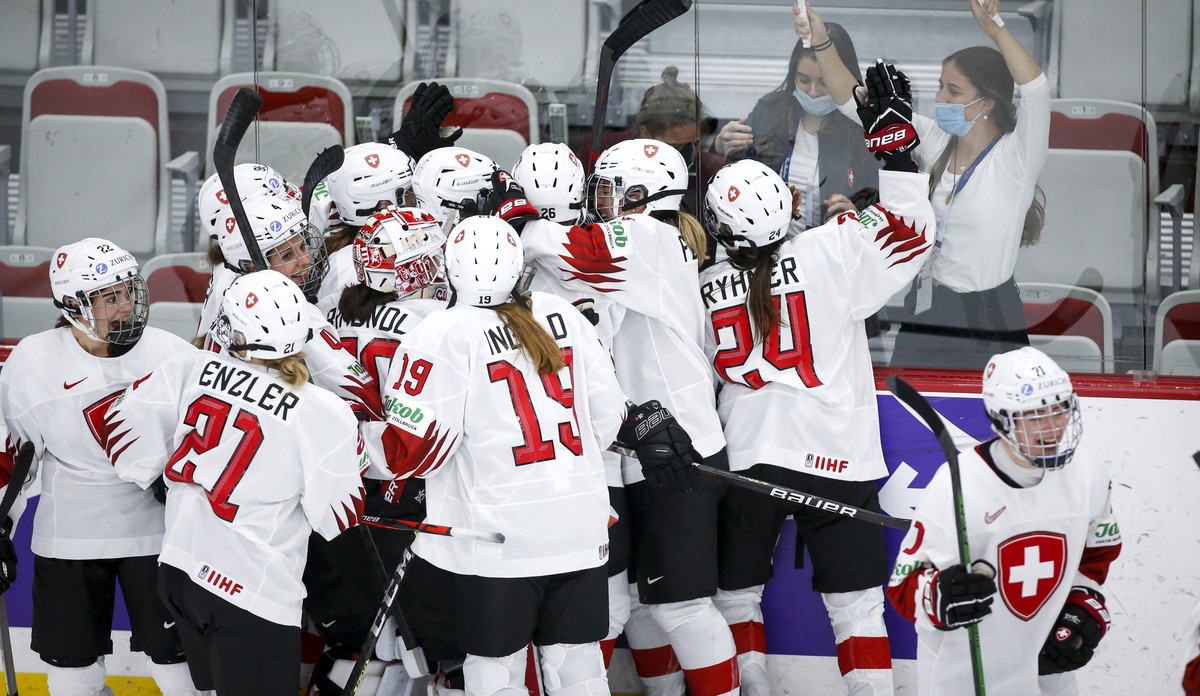Switzerland celebrate after defeating Russian Olympic Committee during overtime quarterfinal IIHF Women's World Championship hockey game in Calgary, Alta., Saturday, Aug. 28, 2021. (Jeff McIntosh ...