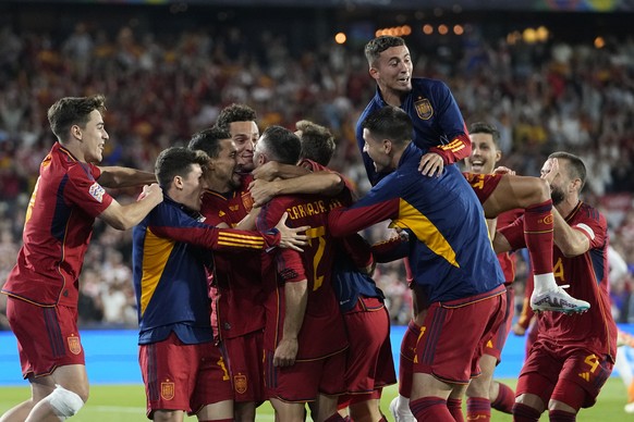 Spain players celebrate after winning the Nations League final soccer match between Croatia and Spain at De Kuip stadium in Rotterdam, Netherlands, Sunday, June 18, 2023. (AP Photo/Martin Meissner)