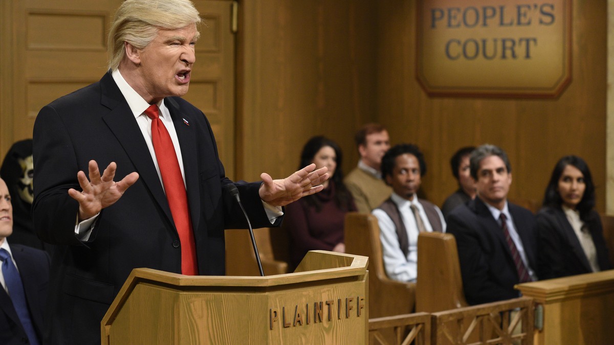 This Saturday, Feb. 11, 2017, image released by NBC shows host Alec Baldwin as President Donald Trump during the "Trump People's Court" in New York. In his spoof, President Trump made g ...