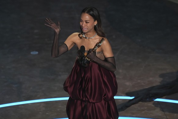 Zoe Saldana accepts the award for best performance by an actress in a supporting role for &quot;Emilia Perez&quot; during the Oscars on Sunday, March 2, 2025, at the Dolby Theatre in Los Angeles. (AP  ...